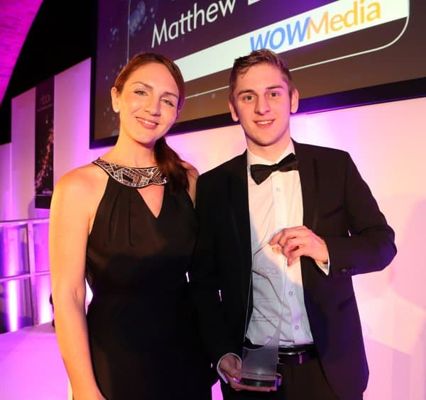 Matt Lovett winning an award for WOW Media
